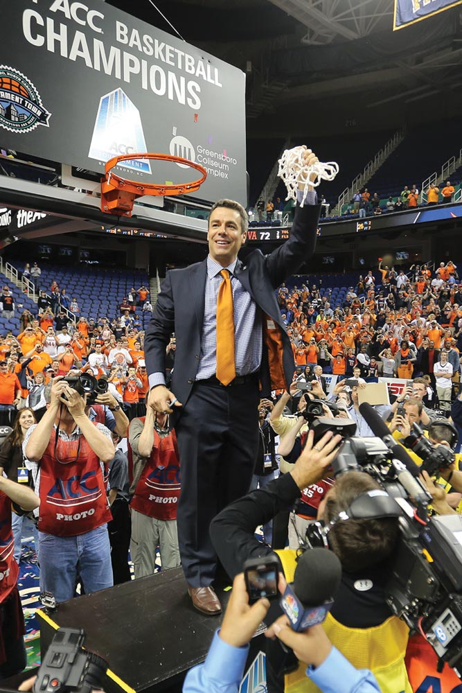 Coach Tony Bennett cuts down the nets after winning the ACC Championship