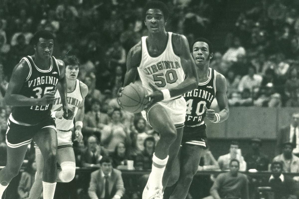 Ralph Sampson moving the ball up court in a game against Virginia Tech