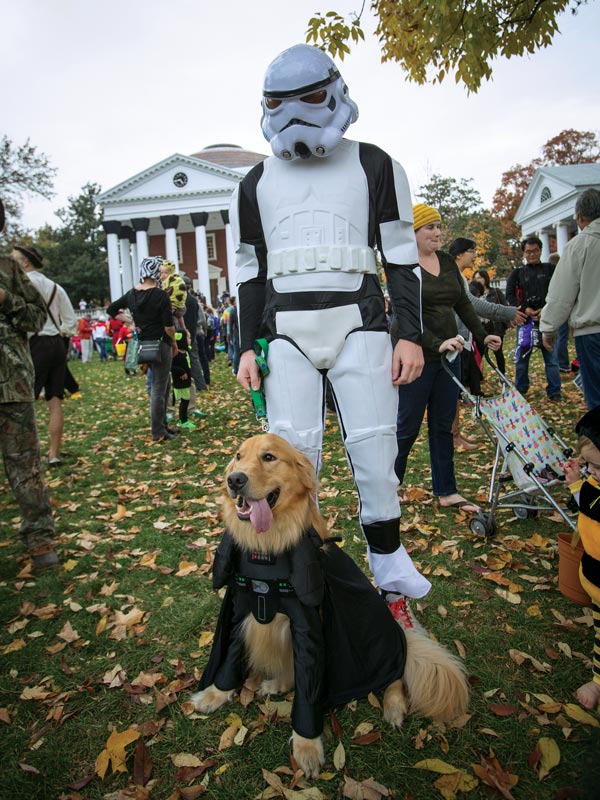 A trick-or-treater dressed as a stormtrooper with their dog as Darth Vader
