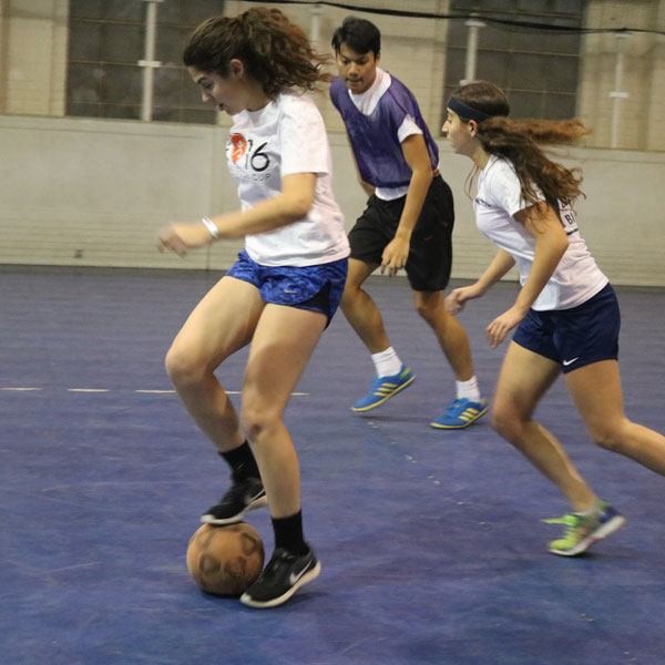 Students playing soccer