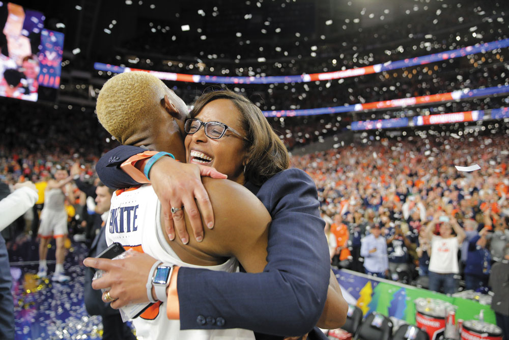Diakite and Athletic Director Carla Williams hug