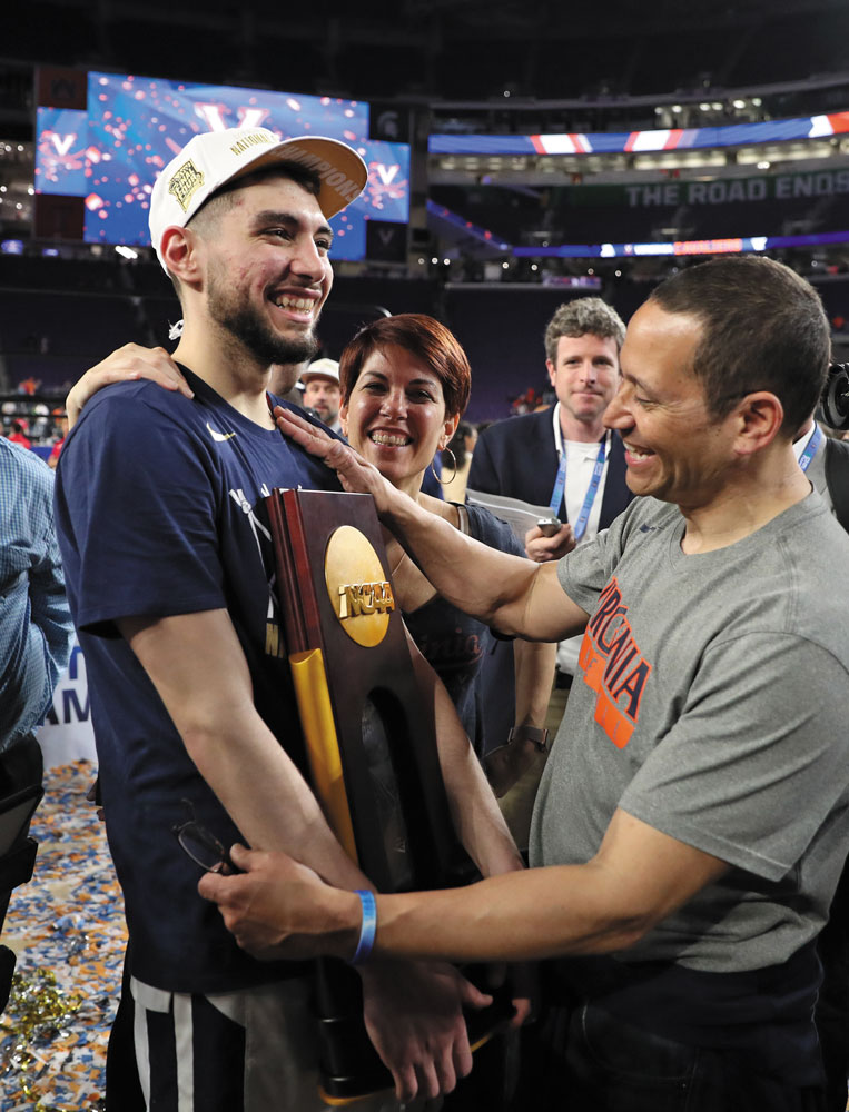 Ty Jerome celebrates with his parents