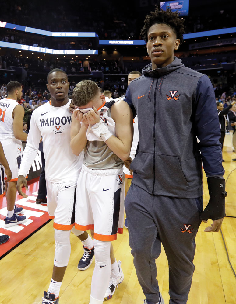 UVA players leave the court after the historic March 2018 loss to No. 16-seed UMBC
