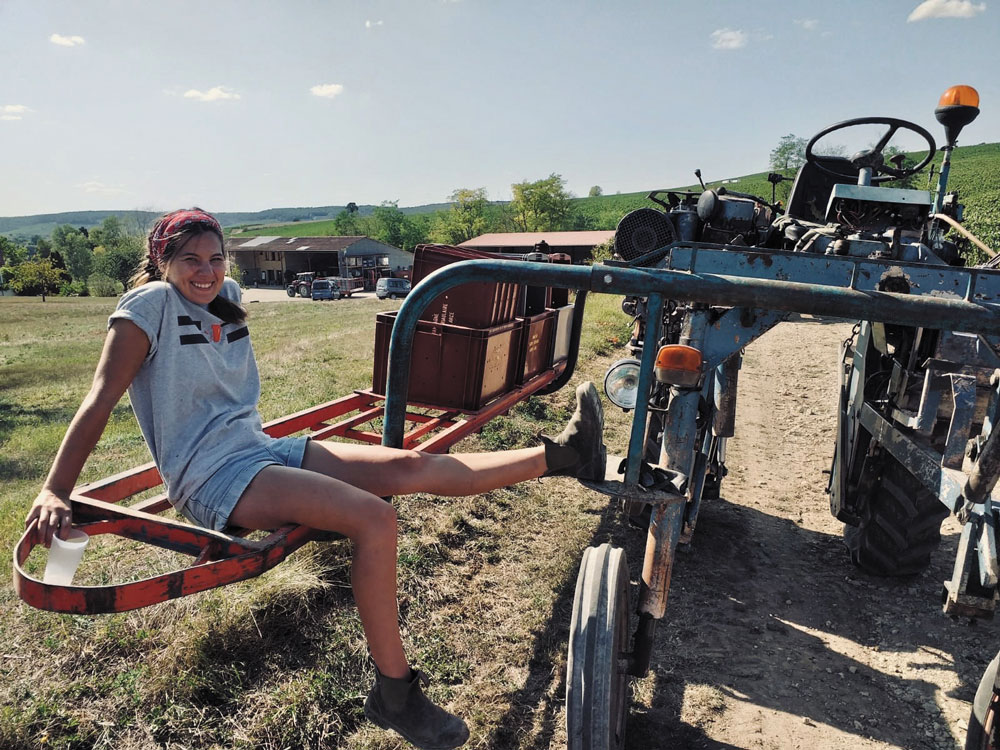 Harriet Kiers sitting on farm equipment