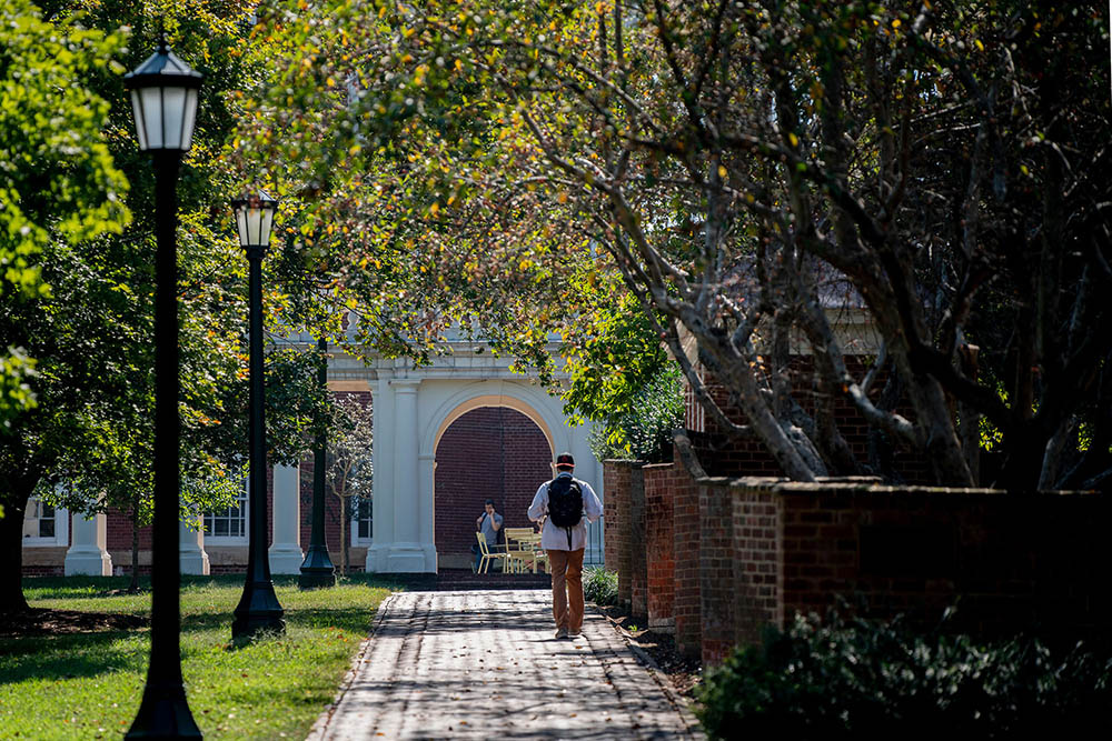 Student walks on UVA Grounds