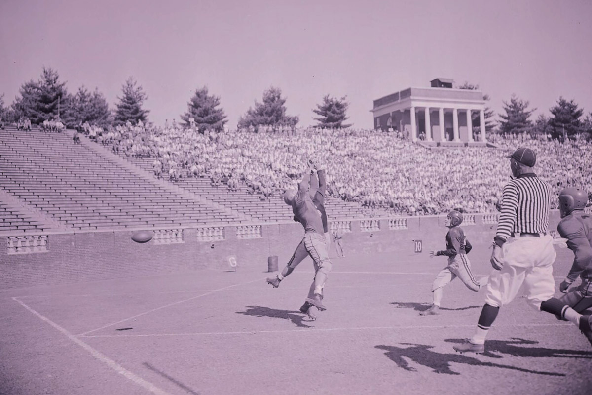 Black and white image of football game