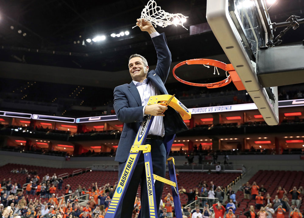 Bennett cuts down the net after UVA beat Purdue to earn a trip to the Final Four